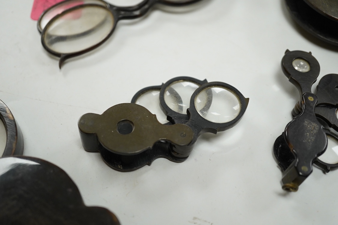 A group of 19th-century horn framed loupes, quizzing glasses and four optician multiple lens sizing lorgnettes (13)